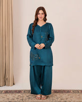 Peacock Whisper – Teal silk outfit with golden sequins and floral handwork
