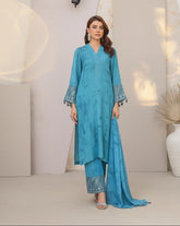 Model wearing Emeralds “Dream Catcher” — an aqua blue embroidered raw silk 3-piece set with silver detailing and Silk dupatta.