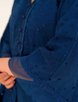 Model in navy blue chikankari embroidered lawn kaftan set with lace placket and cotton bell bottom pants by Emeralds
