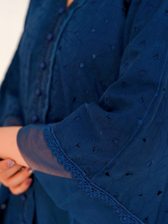 Model in navy blue chikankari embroidered lawn kaftan set with lace placket and cotton bell bottom pants by Emeralds