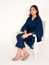 Model in navy blue chikankari embroidered lawn kaftan set with lace placket and cotton bell bottom pants by Emeralds