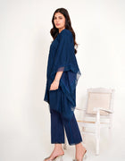 Model in navy blue chikankari embroidered lawn kaftan set with lace placket and cotton bell bottom pants by Emeralds