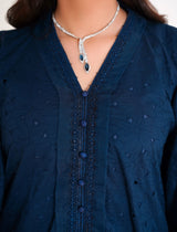 Model in navy blue chikankari embroidered lawn kaftan set with lace placket and cotton bell bottom pants by Emeralds