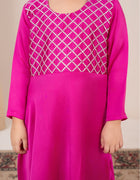 Pink dress with white lattice pattern on a plain background