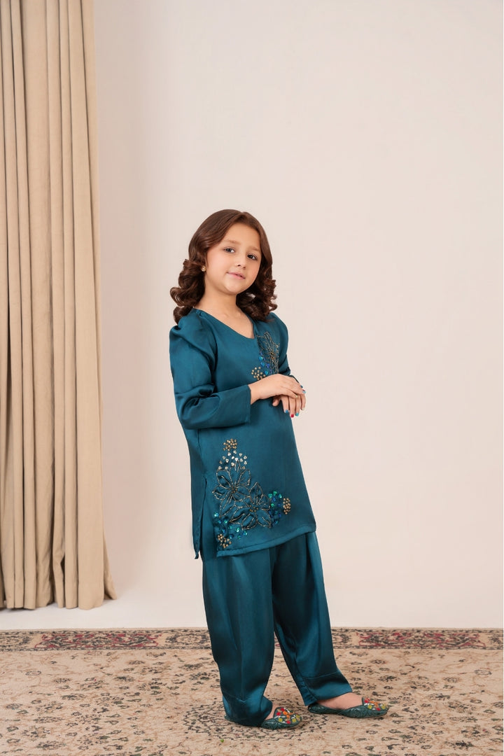 Close-up of sequin and pipe floral hand embellishments on Mini Peacock Whisper