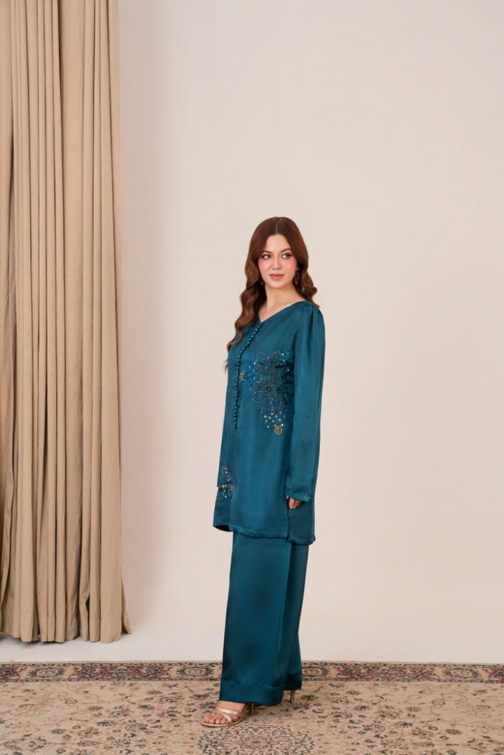 Close-up of hand-embellished floral bunches on Peacock Whisper shirt