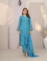 Model wearing Emeralds “Dream Catcher” — an aqua blue embroidered raw silk 3-piece set with silver detailing and Silk dupatta.