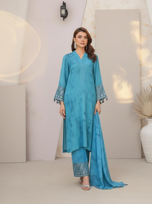 Model wearing Emeralds “Dream Catcher” — an aqua blue embroidered raw silk 3-piece set with silver detailing and Silk dupatta.