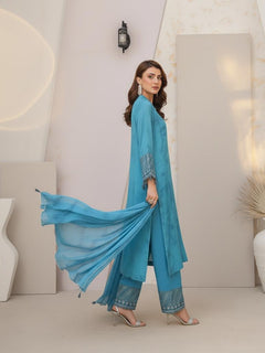 Model wearing Emeralds “Dream Catcher” — an aqua blue embroidered raw silk 3-piece set with silver detailing and Silk dupatta.