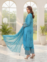 Model wearing Emeralds “Dream Catcher” — an aqua blue embroidered raw silk 3-piece set with silver detailing and Silk dupatta.