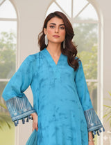 Model wearing Emeralds “Dream Catcher” — an aqua blue embroidered raw silk 3-piece set with silver detailing and Silk dupatta.