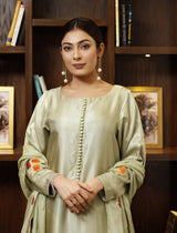 Model wearing stitched pistachio green pure silk outfit with hand-painted full-length shirt and embellished silk dupatta – front, side, and detail views.”