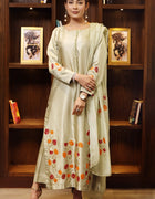Model wearing stitched pistachio green pure silk outfit with hand-painted full-length shirt and embellished silk dupatta – front, side, and detail views.”