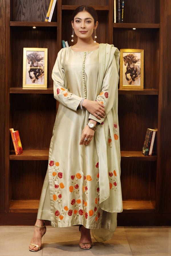 Model wearing stitched pistachio green pure silk outfit with hand-painted full-length shirt and embellished silk dupatta – front, side, and detail views.”