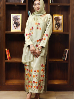 Model wearing stitched pistachio green pure silk outfit with hand-painted full-length shirt and embellished silk dupatta – front, side, and detail views.”