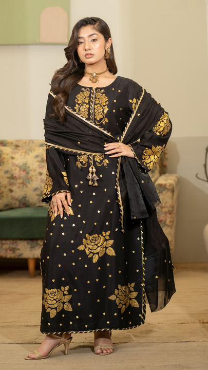 Black silk festive outfit with hand-painted golden rose motifs and intricate adda work – EmeraldsPK