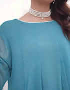 “Model wearing a flowing ocean blue embroidered chiffon frock with silk dupatta – front, side, and seated views for a formal traditional look.”