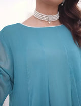 “Model wearing a flowing ocean blue embroidered chiffon frock with silk dupatta – front, side, and seated views for a formal traditional look.”