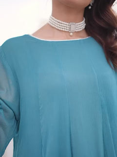 “Model wearing a flowing ocean blue embroidered chiffon frock with silk dupatta – front, side, and seated views for a formal traditional look.”